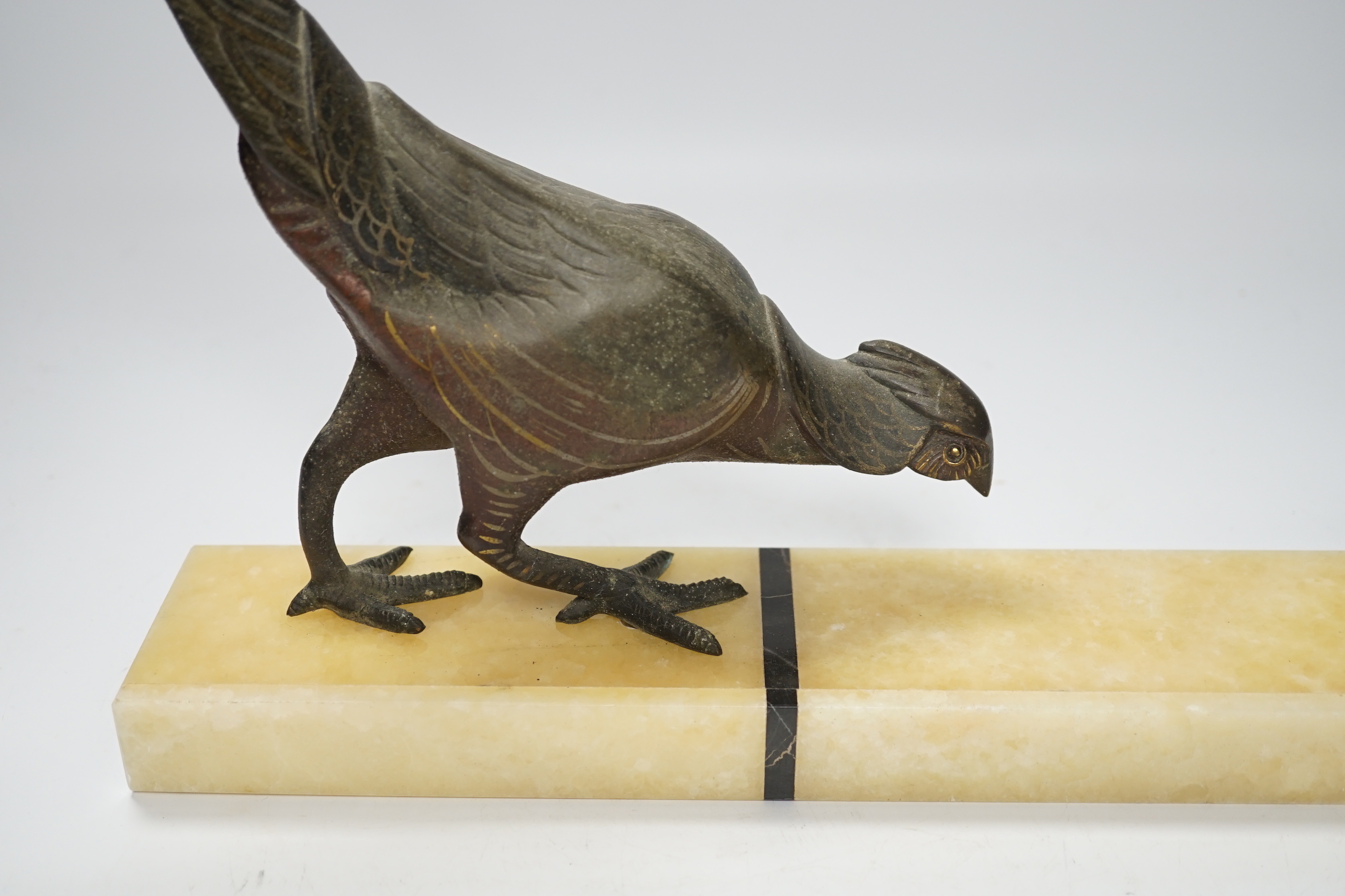 An Art Deco style spelter pheasant on rectangular onyx base, 55cm wide